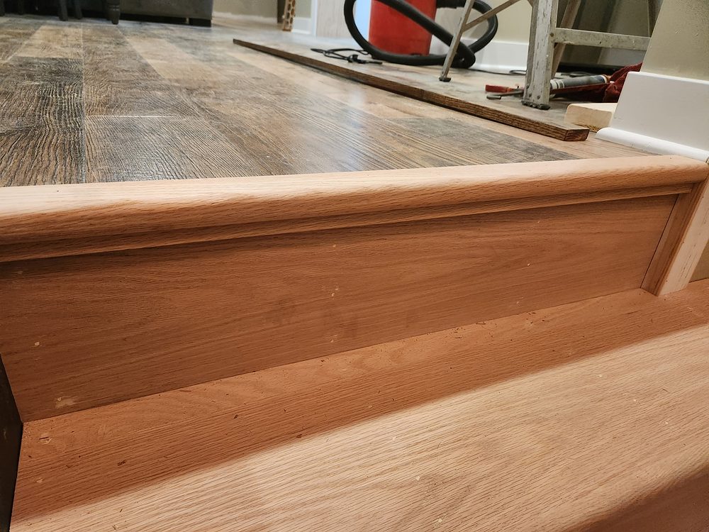 Custom stair and floor transition millwork